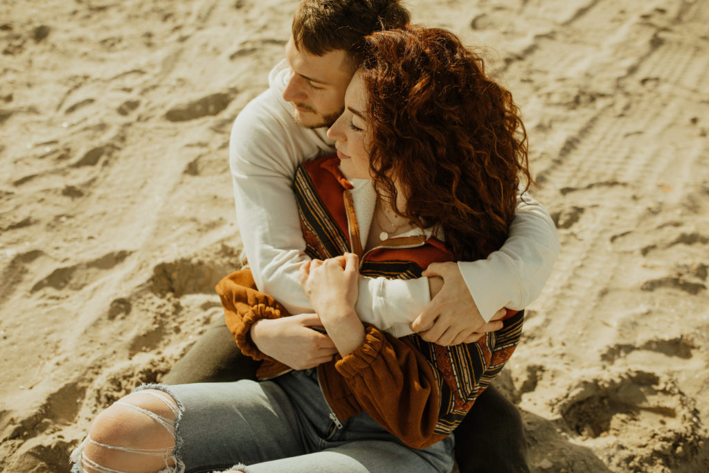 A couple at ocean city new jersey during their engagement photoshoot