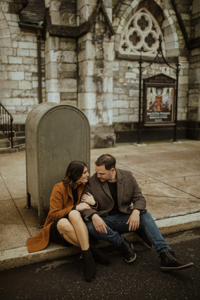 Winter city engagement photoshoot with a mail box