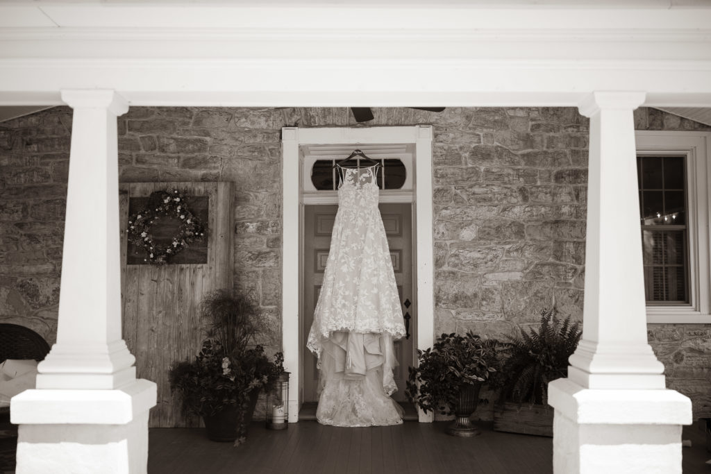 Wedding details of the dress hanging 