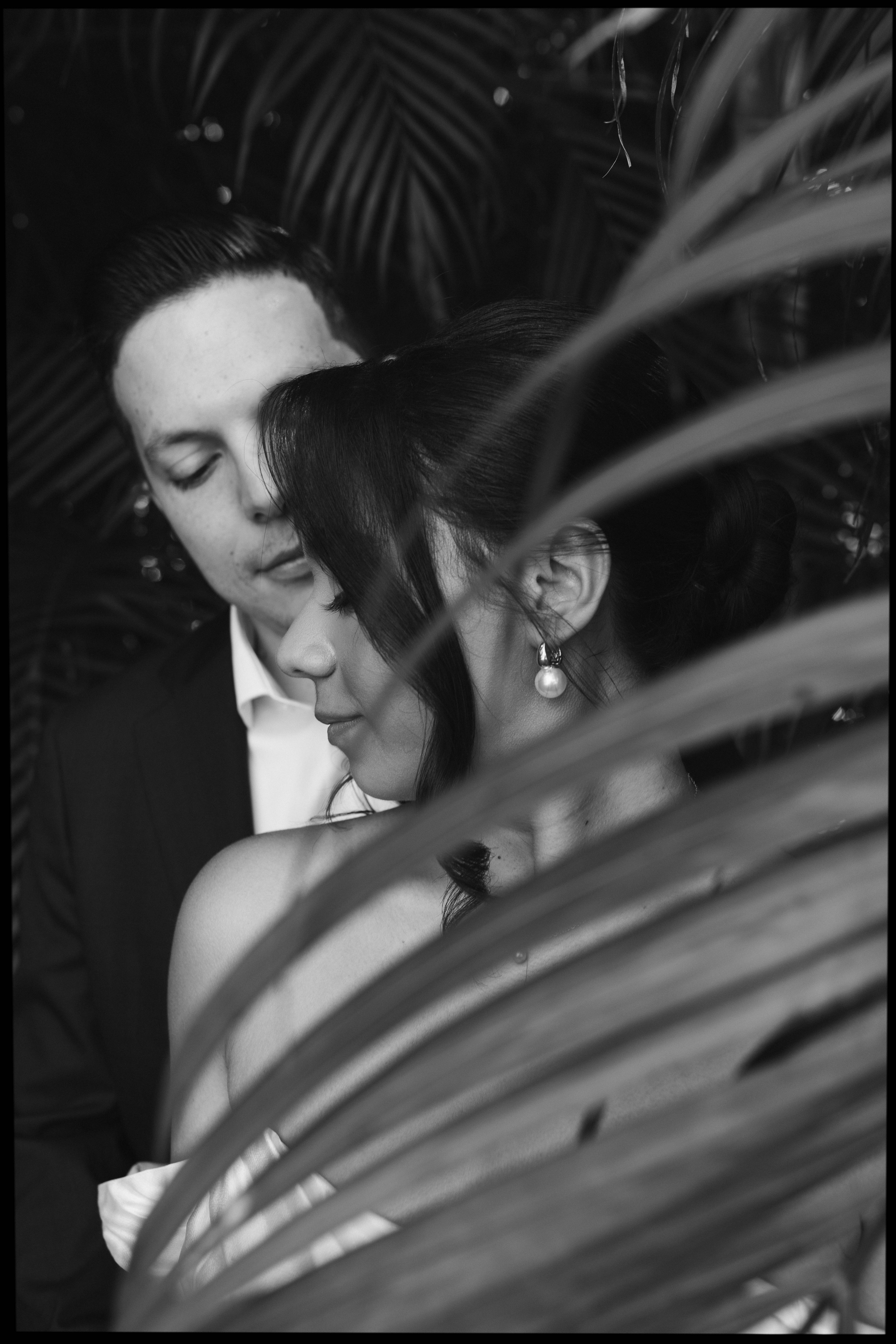 Elegant wedding couple photographed in front of European-style stone walls at The Spanish Monastery.