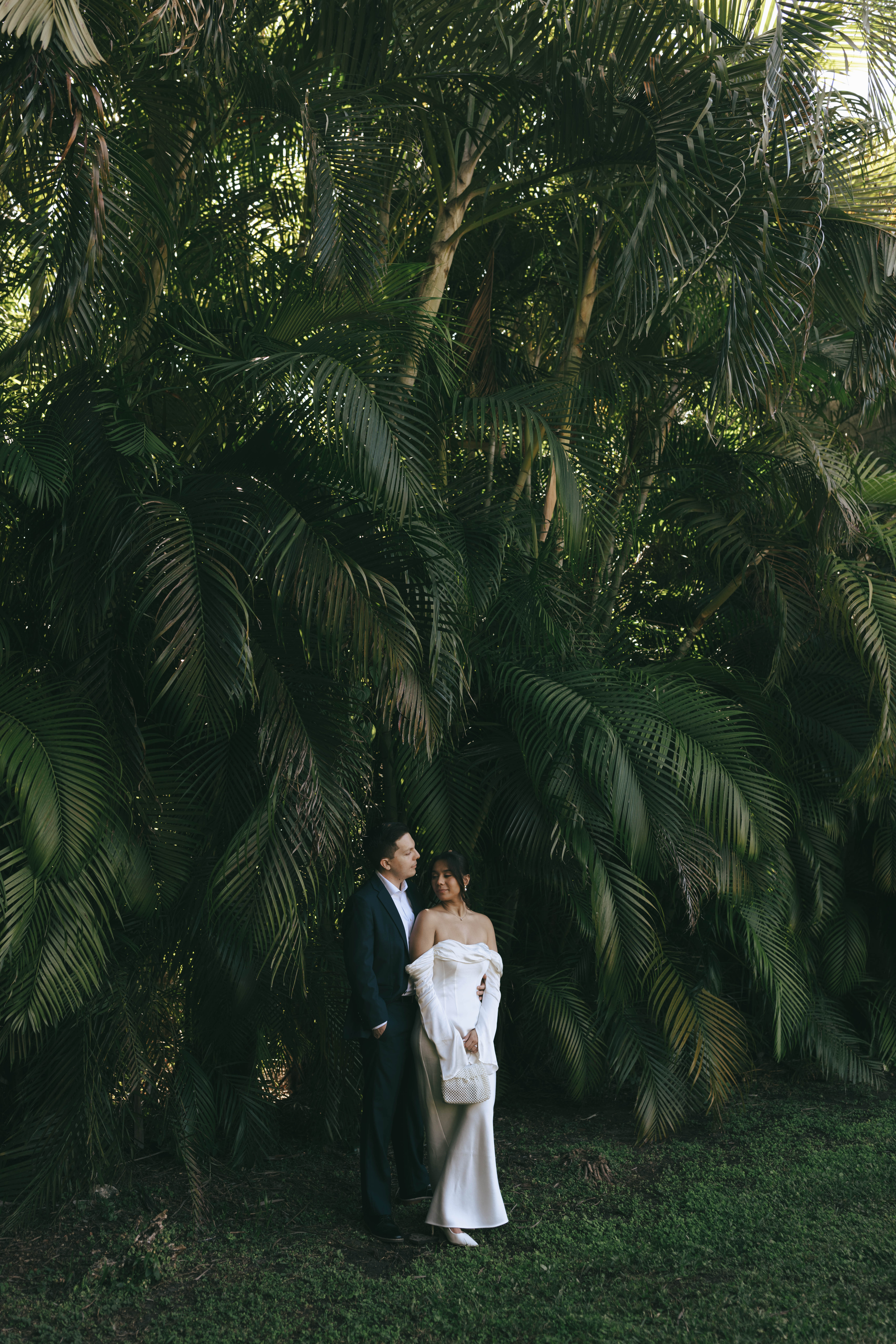 Elegant wedding couple photographed in front of European-style stone walls at The Spanish Monastery.