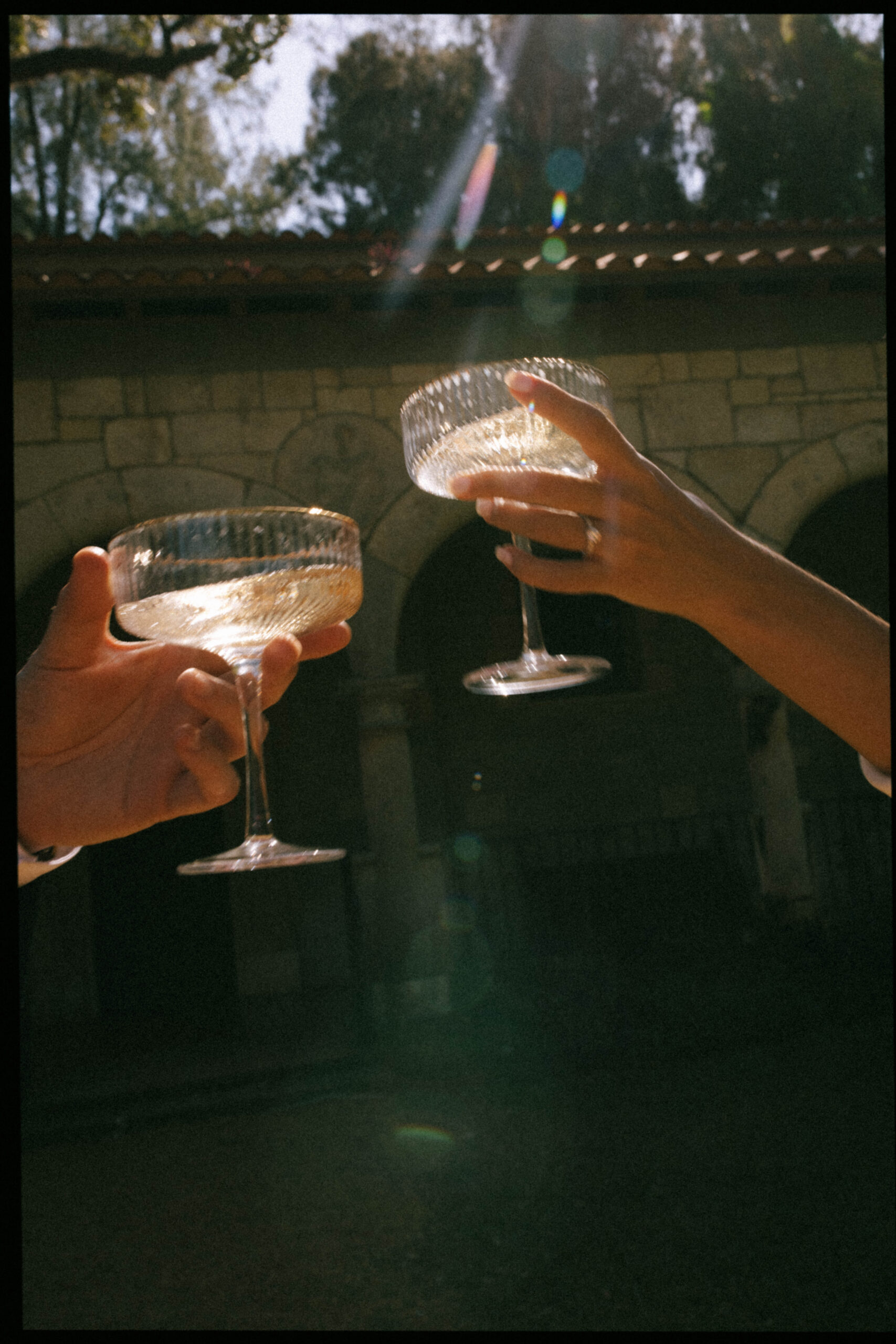 Elegant wedding couple photographed in front of European-style stone walls at The Spanish Monastery.