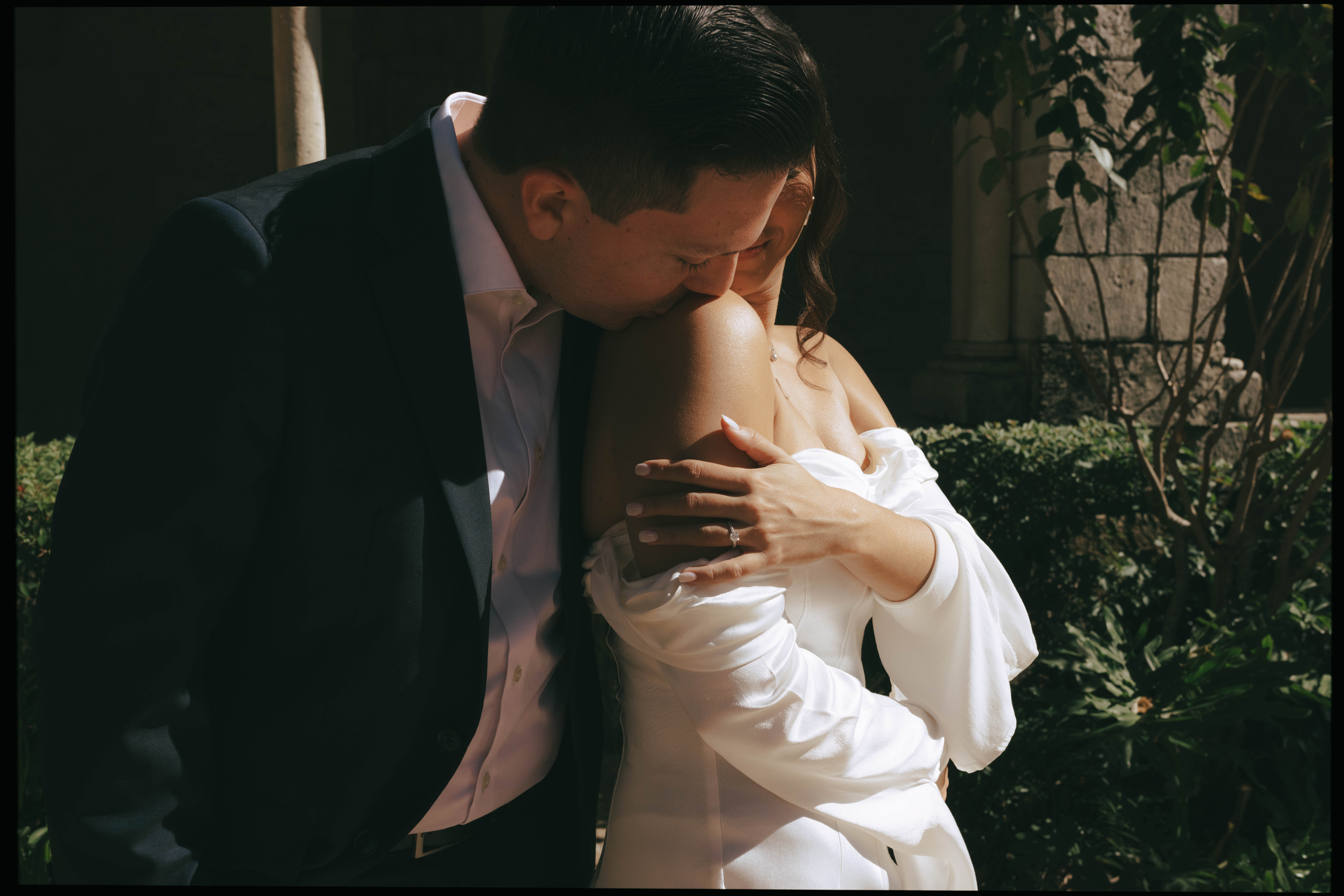Romantic newlywed portraits in the gardens of The Spanish Monastery, a popular South Florida wedding venue