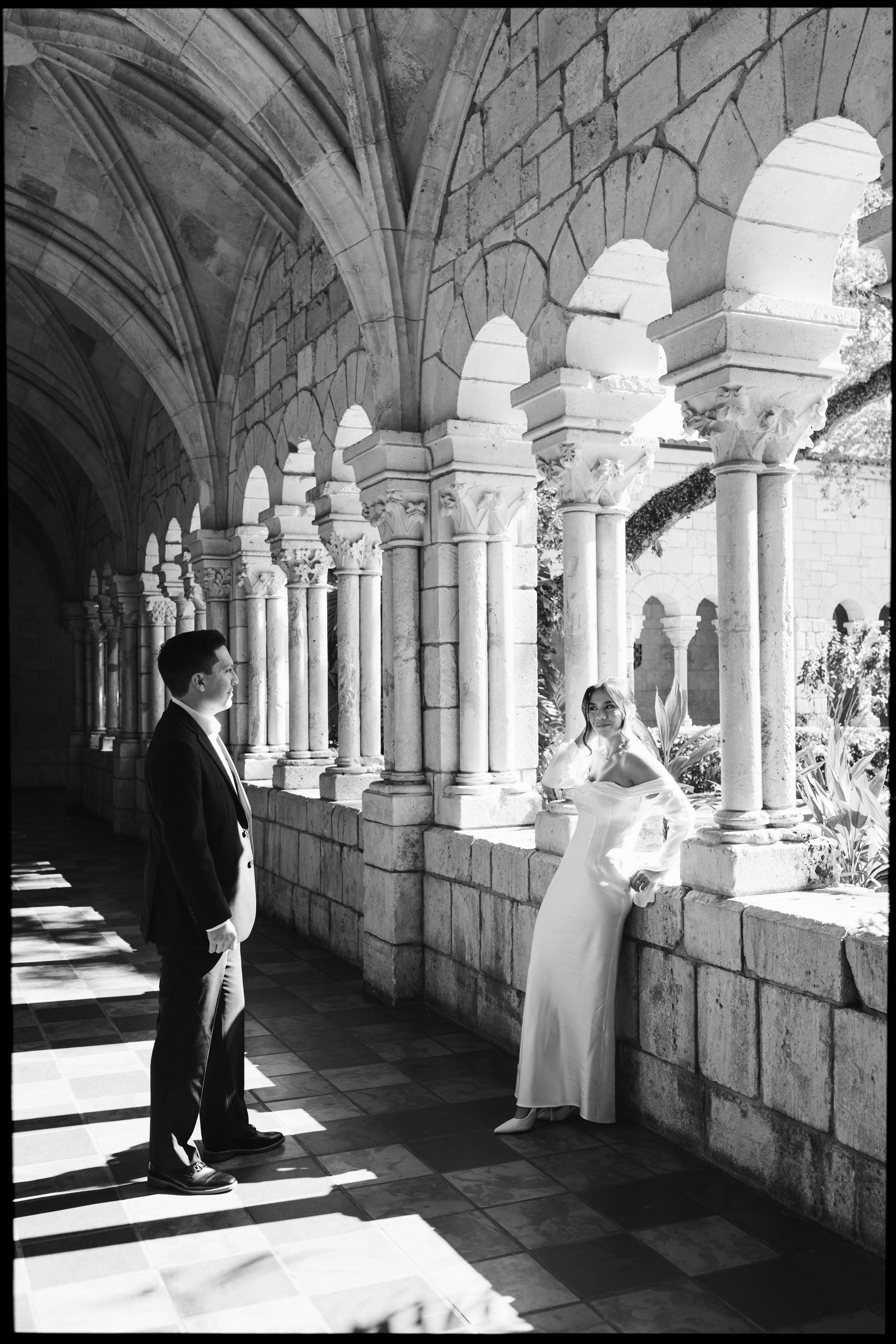 Romantic newlywed portraits in the gardens of The Spanish Monastery, a popular South Florida wedding venue