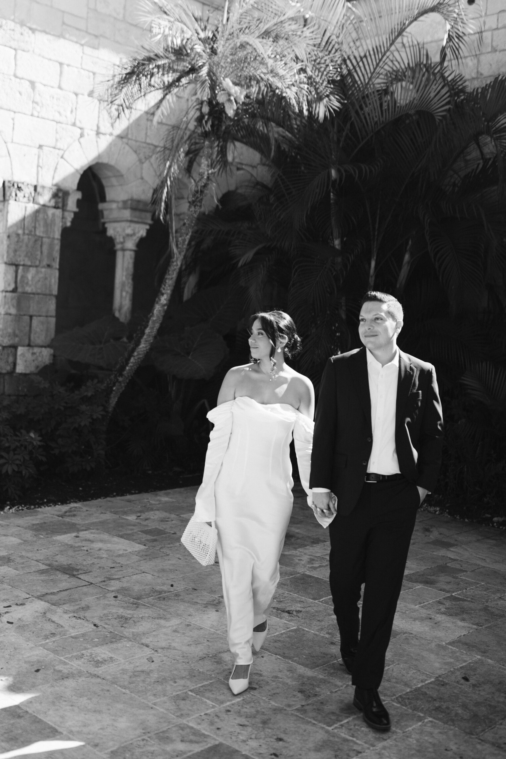 Elegant wedding couple photographed in front of European-style stone walls at The Spanish Monastery.