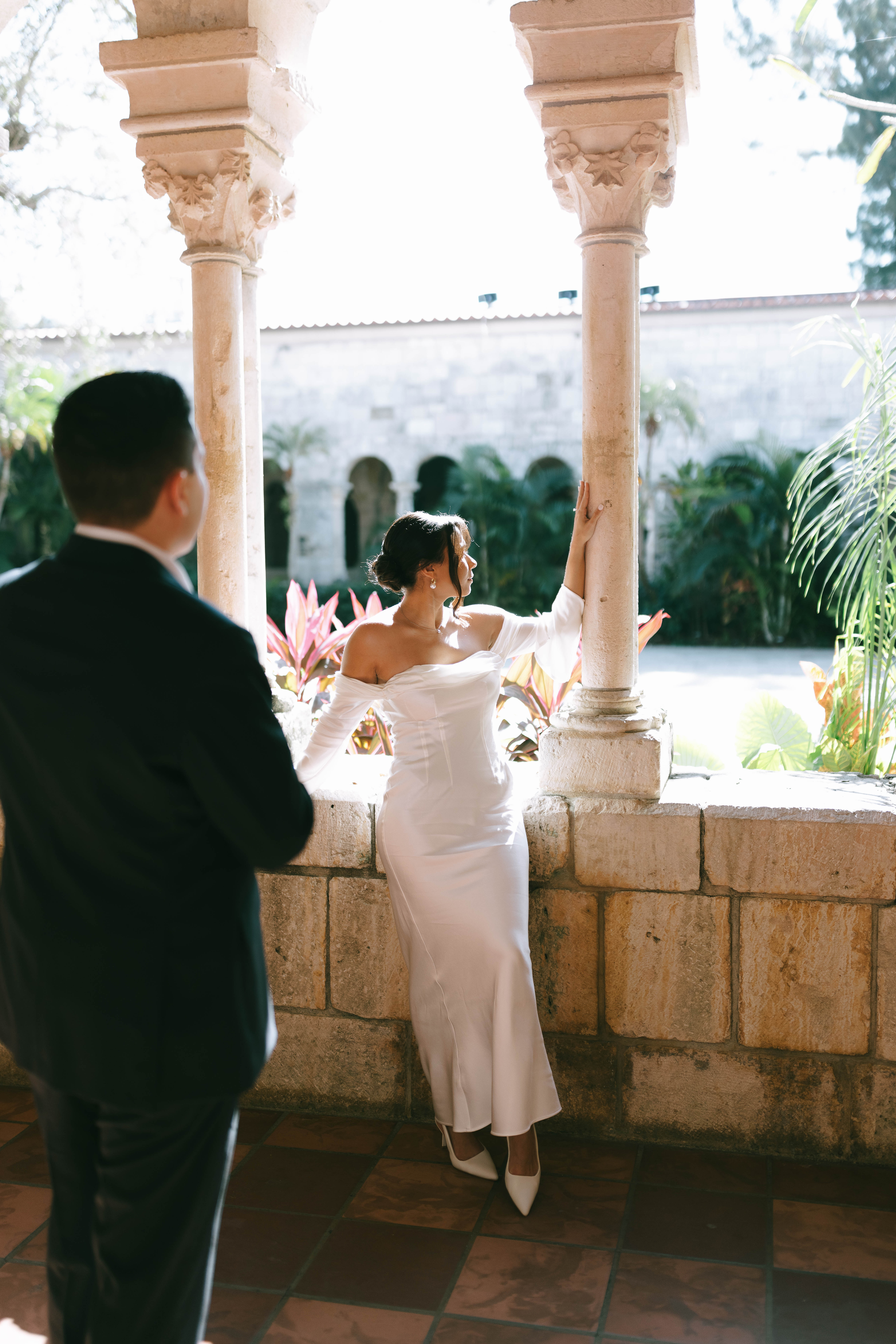 Romantic newlywed portraits in the gardens of The Spanish Monastery, a popular South Florida wedding venue