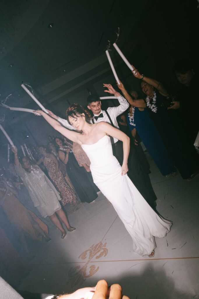 Lively Ritz-Carlton Fort Lauderdale wedding reception with dancing under elegant lighting