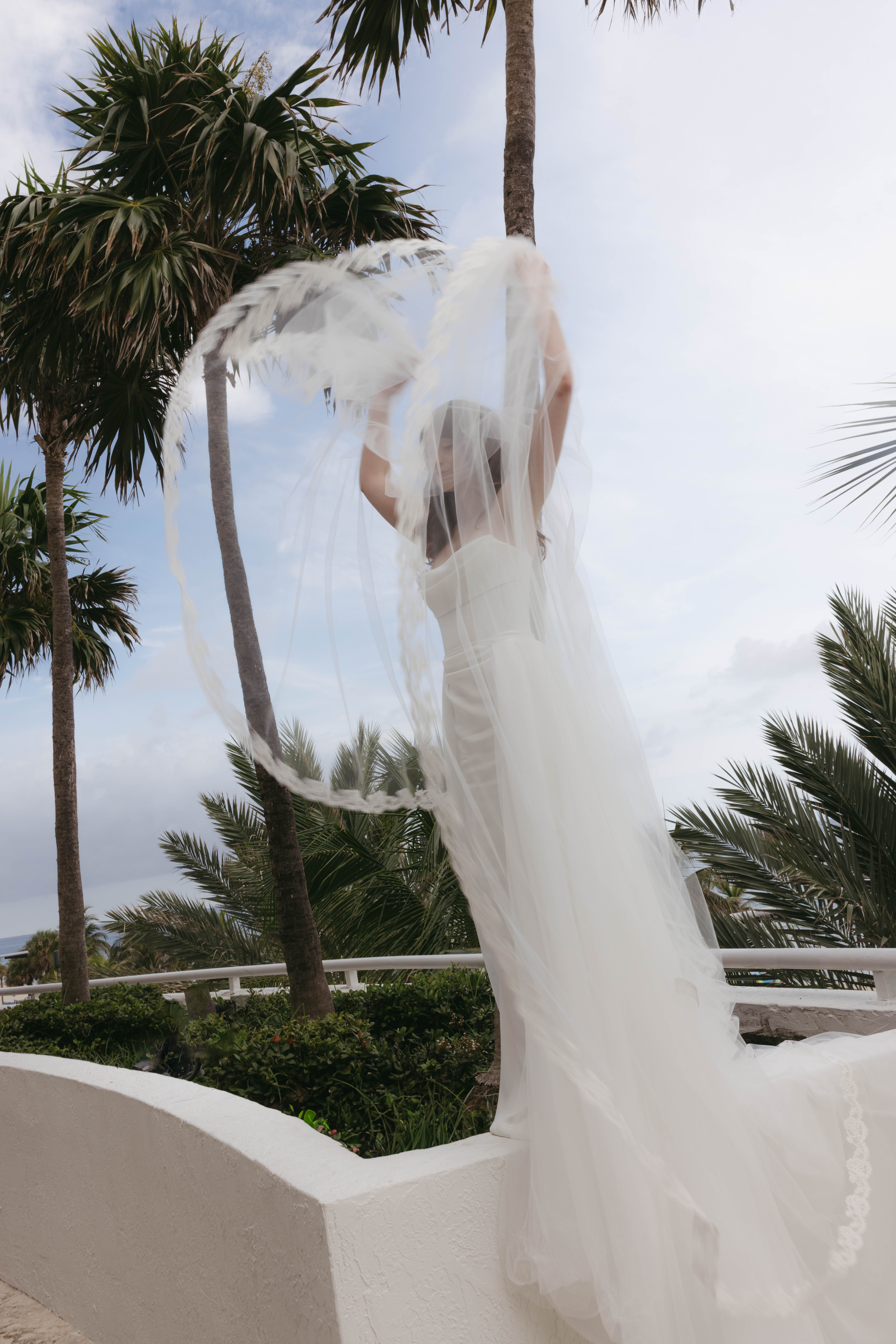 Elegant editorial portraits of bride and groom at The Ritz-Carlton Fort Lauderdale wedding