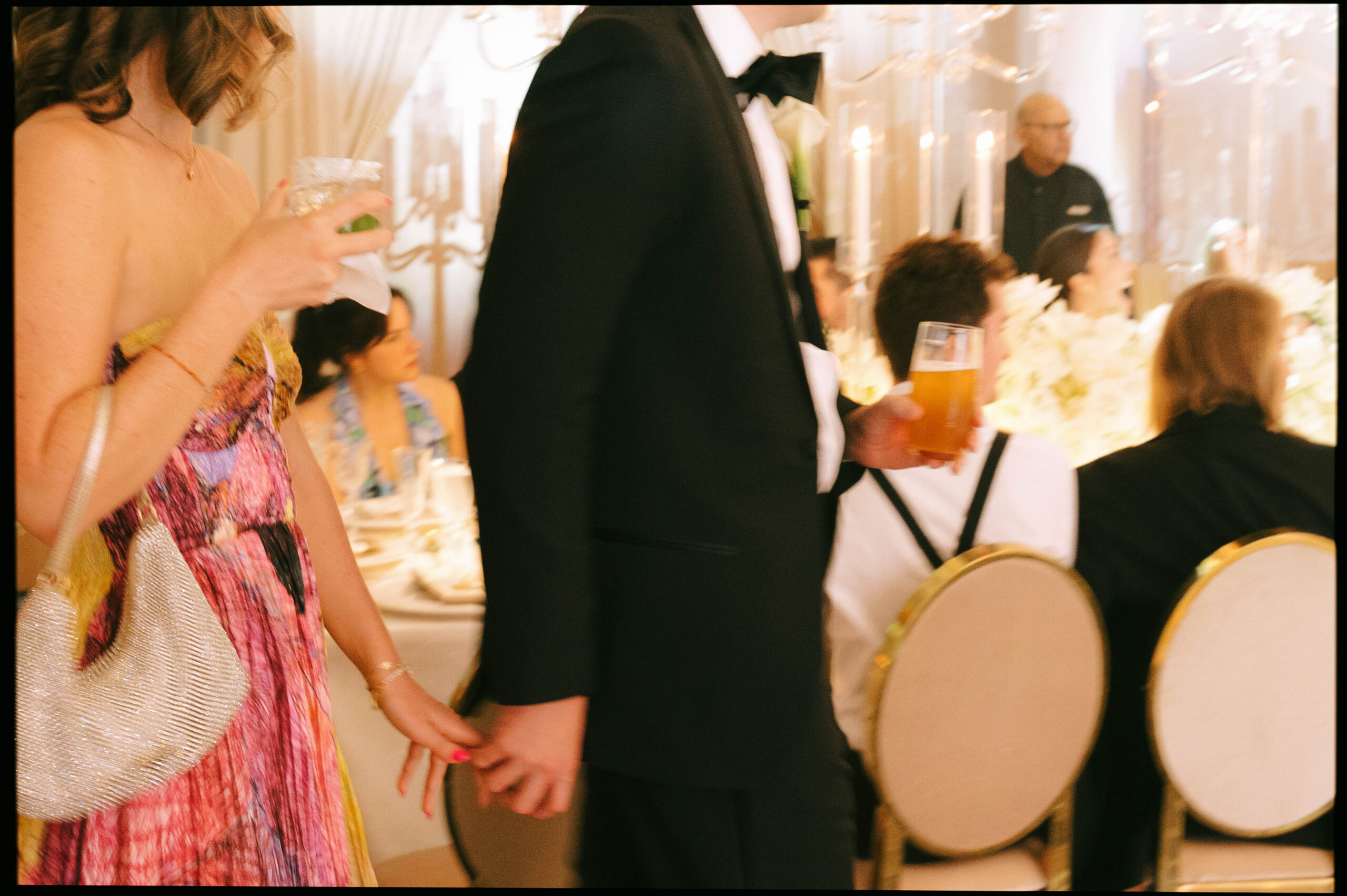 Lively Ritz-Carlton Fort Lauderdale wedding reception with dancing under elegant lighting