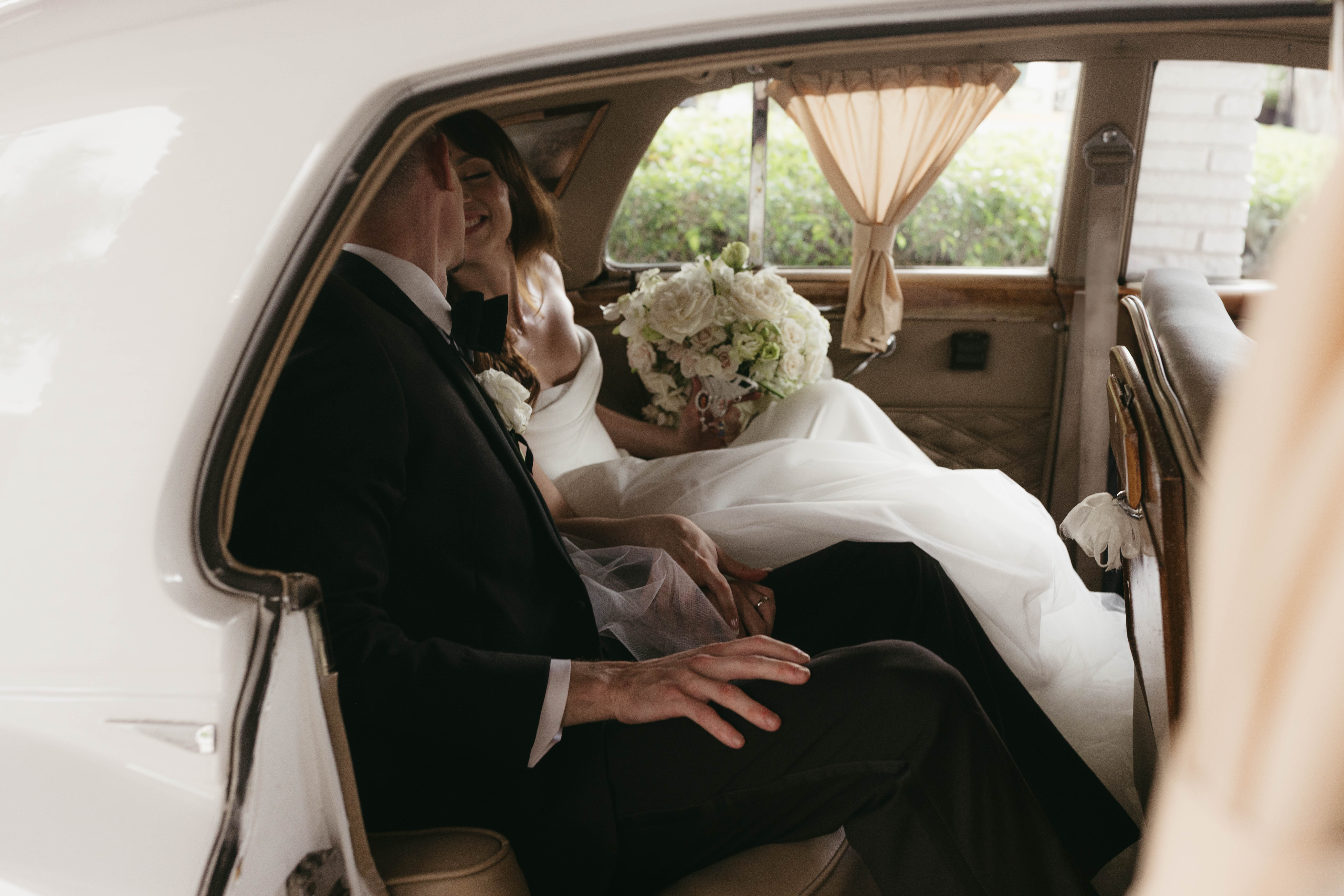Romantic Ritz-Carlton Fort Lauderdale bride and groom car exit