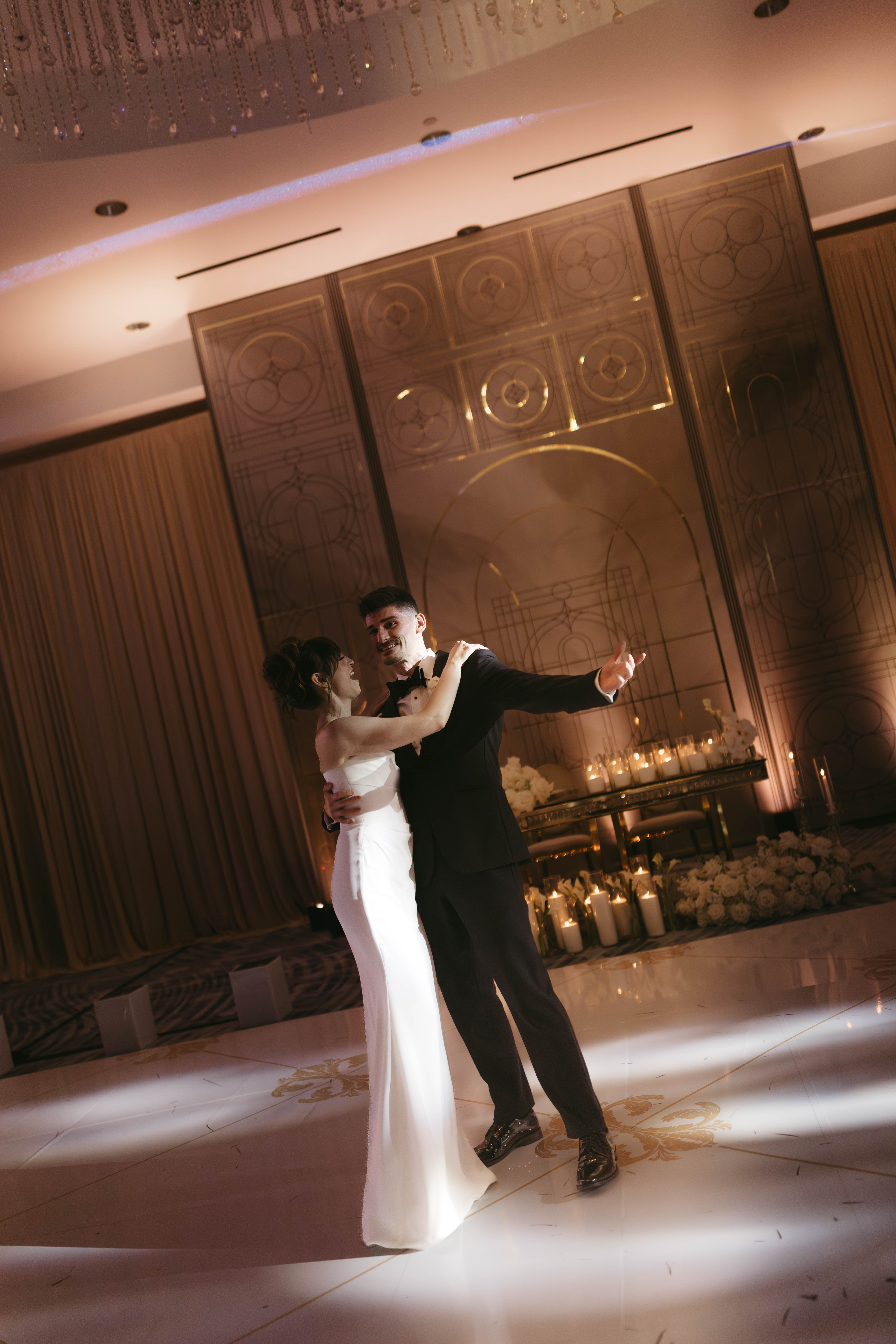 Lively Ritz-Carlton Fort Lauderdale wedding reception with dancing under elegant lighting