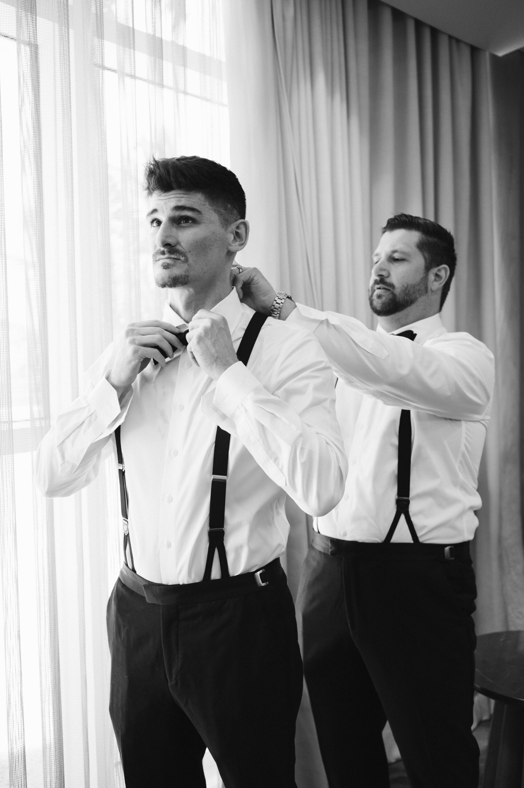 Editorial groom getting ready at The Ritz-Carlton Fort Lauderdale with classic, soft-toned aesthetic