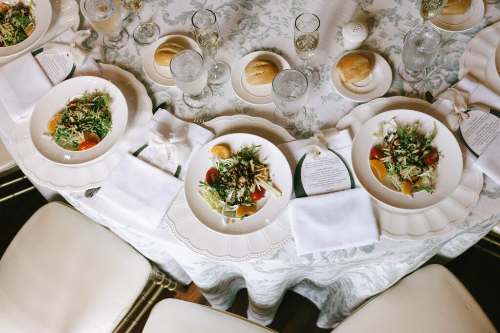 Elegant estate wedding table setting with layered rentals