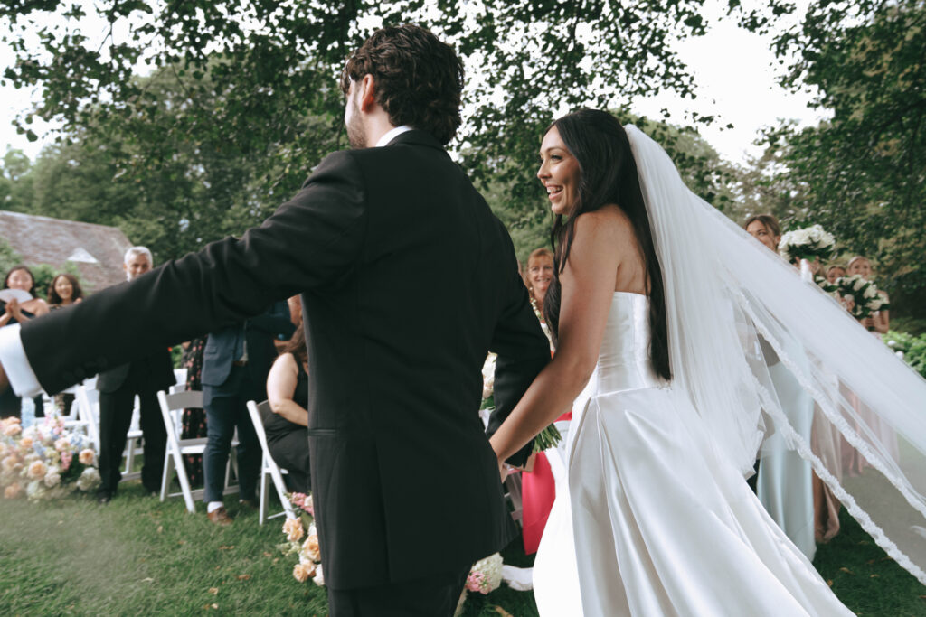 Outdoor wedding ceremony at NYIT de Seversky Mansion in Old Westbury, New York