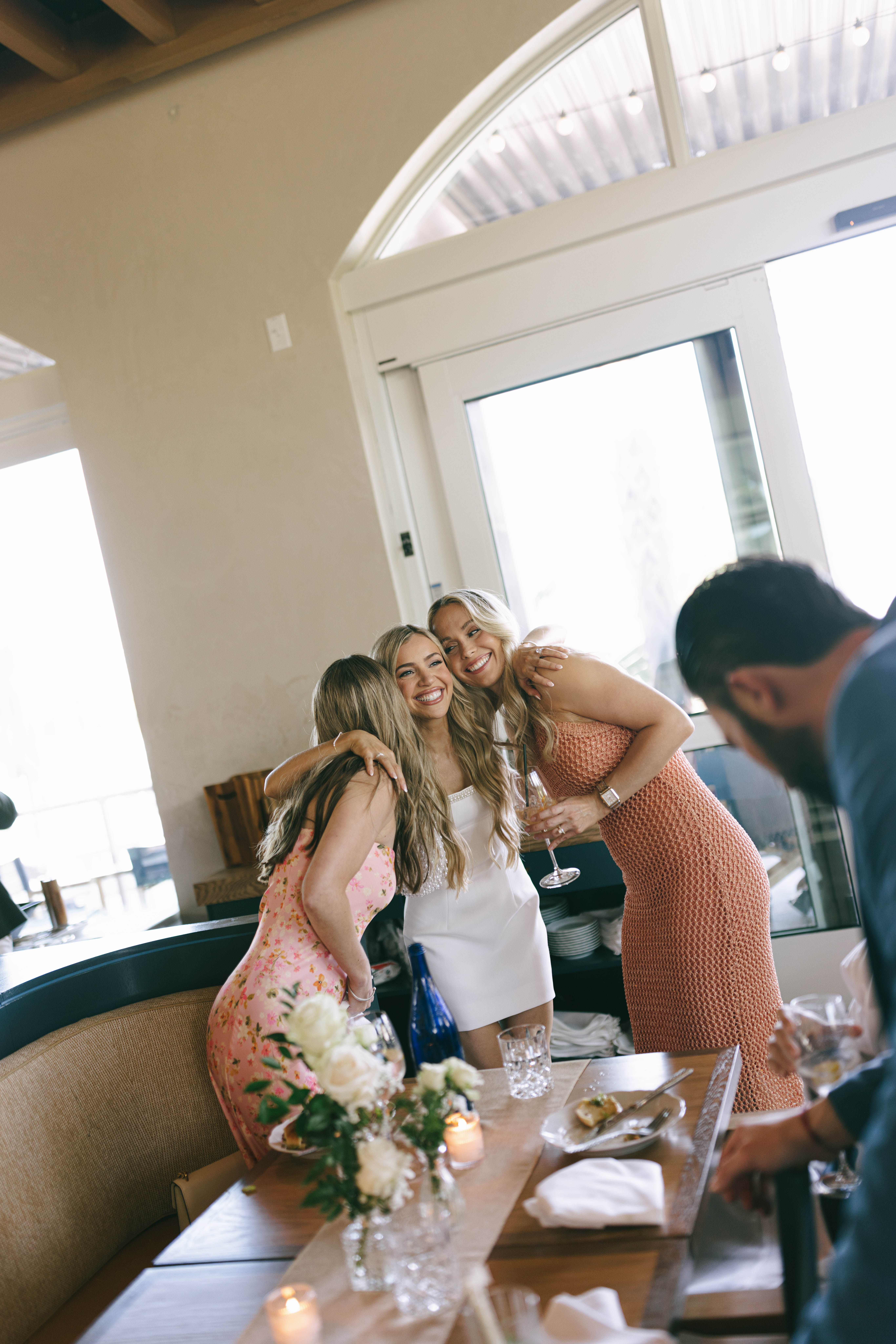 Couples and guests enjoying cocktails at The Beacon welcome party in Jupiter, Florida