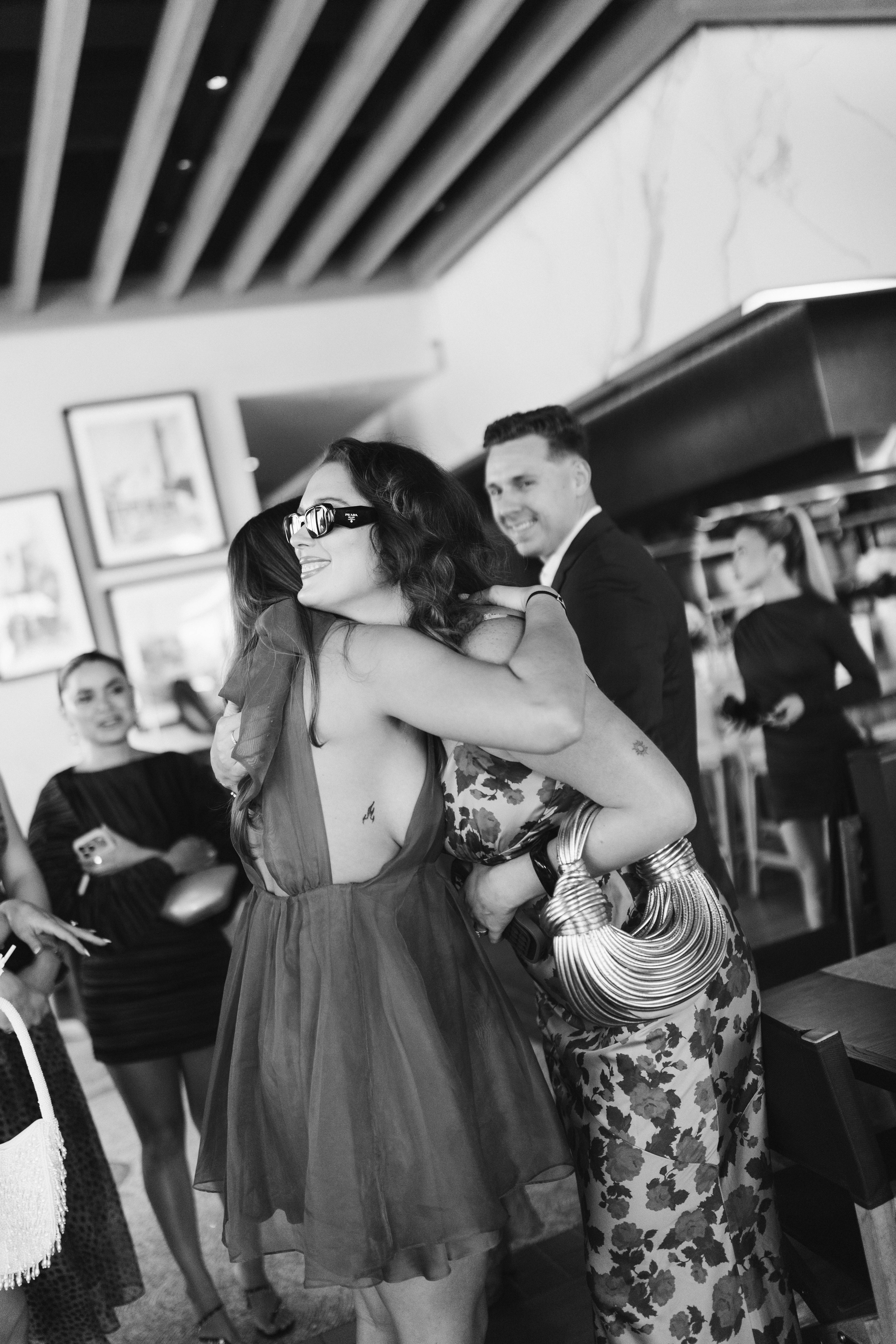 Couples and guests enjoying cocktails at The Beacon welcome party in Jupiter, Florida