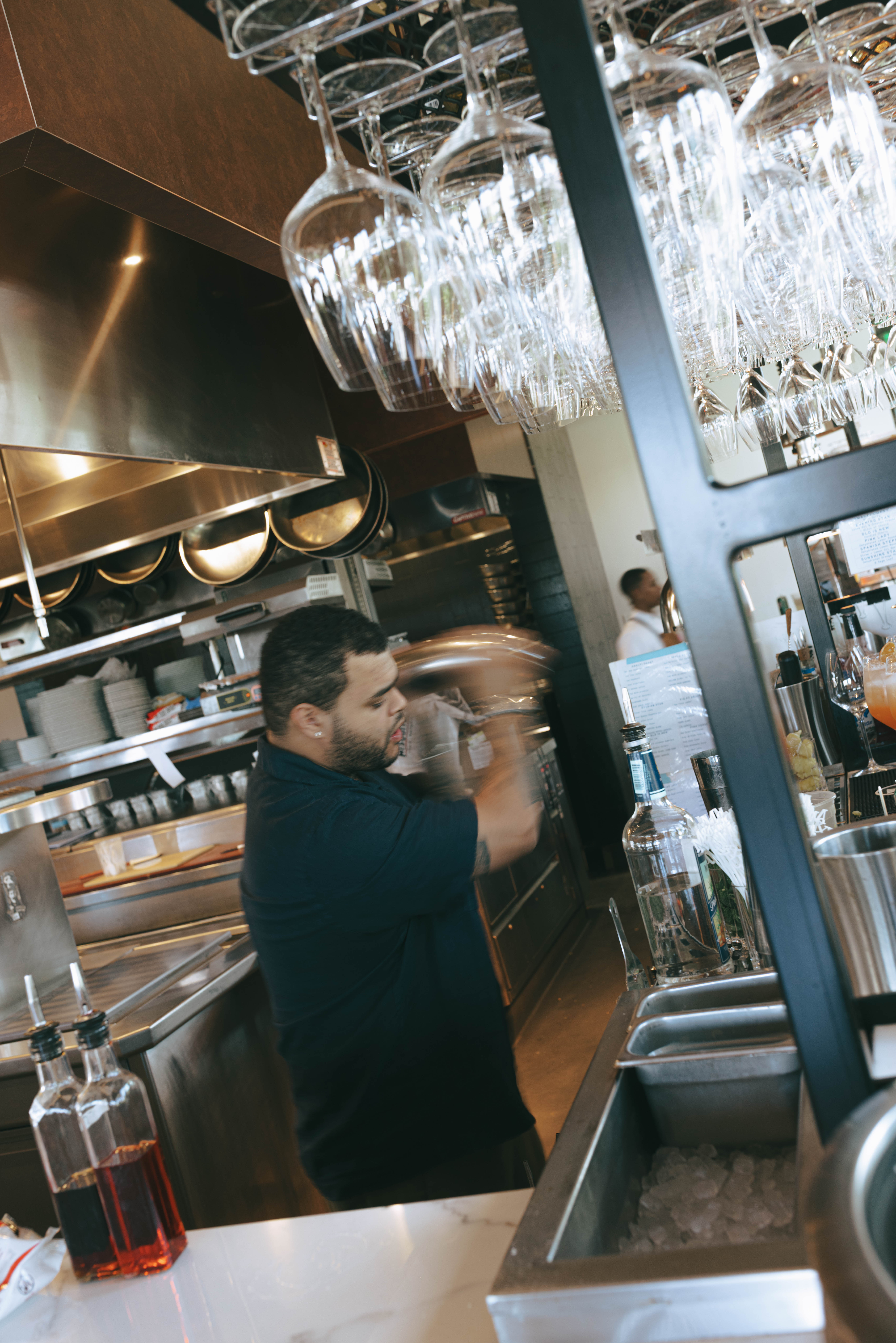 Couples and guests enjoying cocktails at The Beacon welcome party in Jupiter, Florida